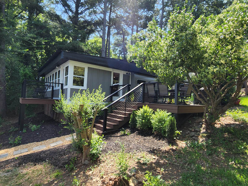 Home exterior project with trees and larger porch area